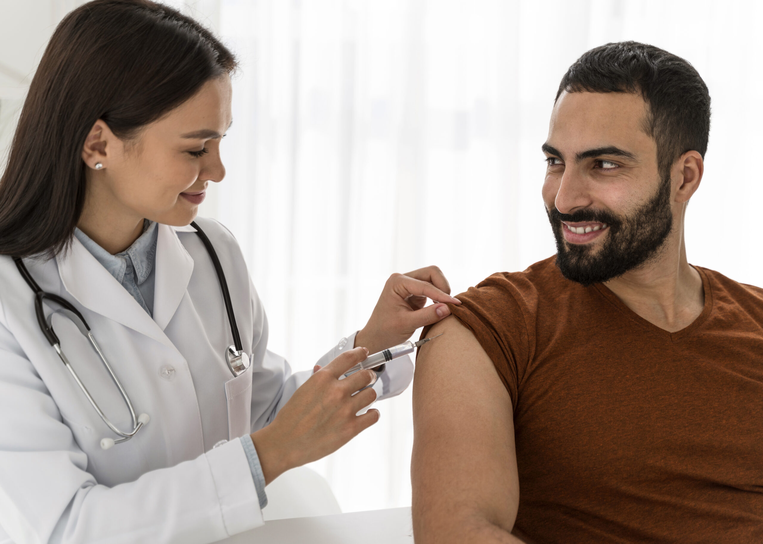 doctor-vaccinating-handsome-man