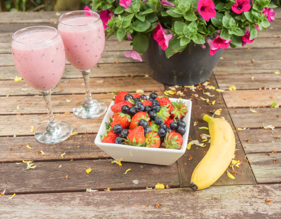 Glass of grape juice with foods for acid reflux relief