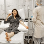 Nurse administering infusion therapy in GI clinic
