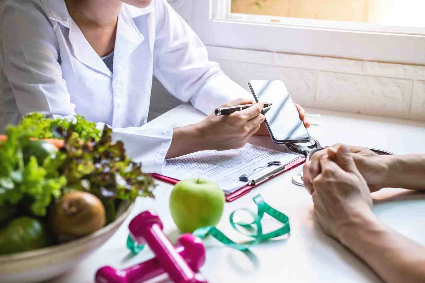 Gastroenterologist consulting patient on GLP-1 weight management plan