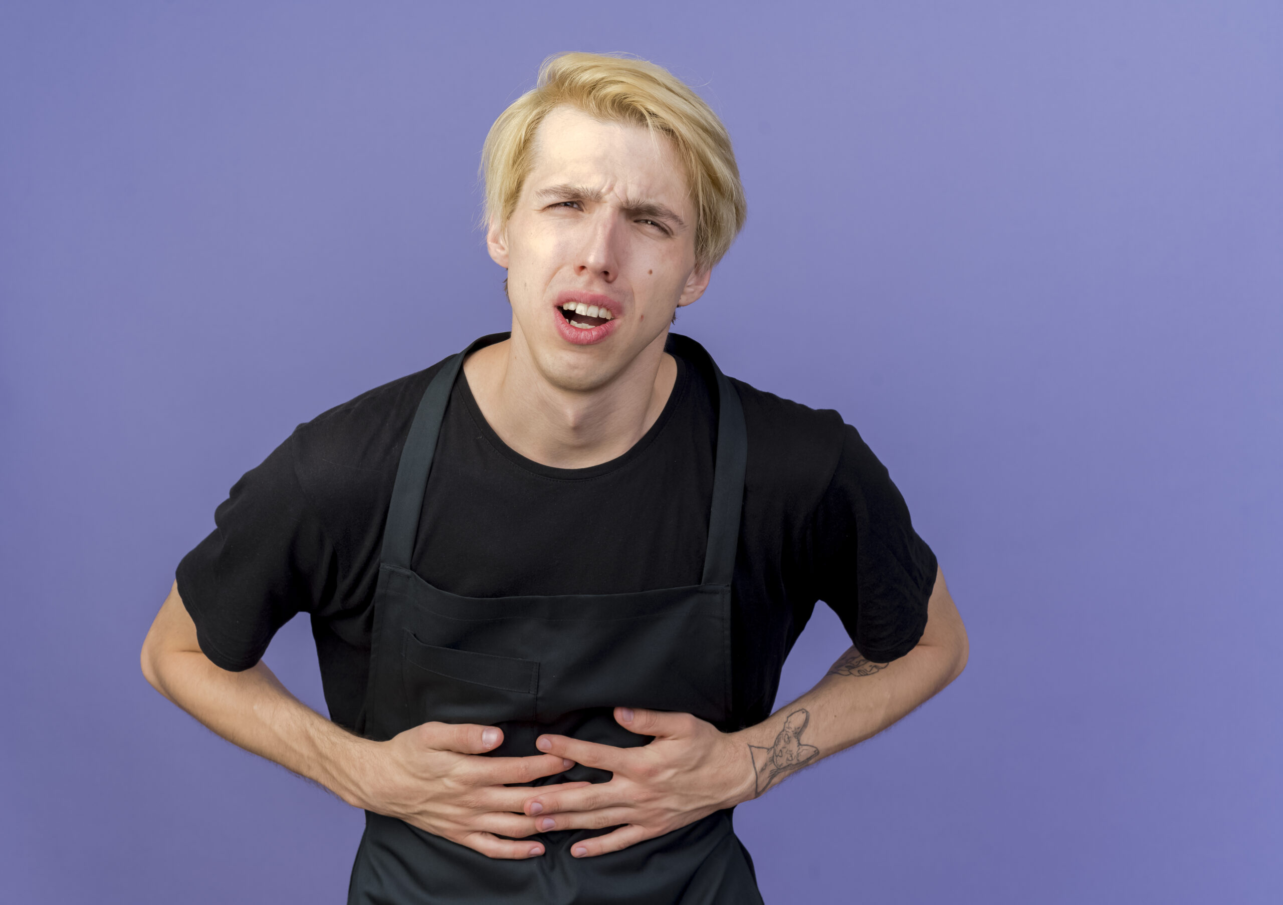 Comparison chart showing normal gas symptoms versus serious stomach problem signs such as persistent bloating, pain, and warning symptoms requiring GI specialist consultation