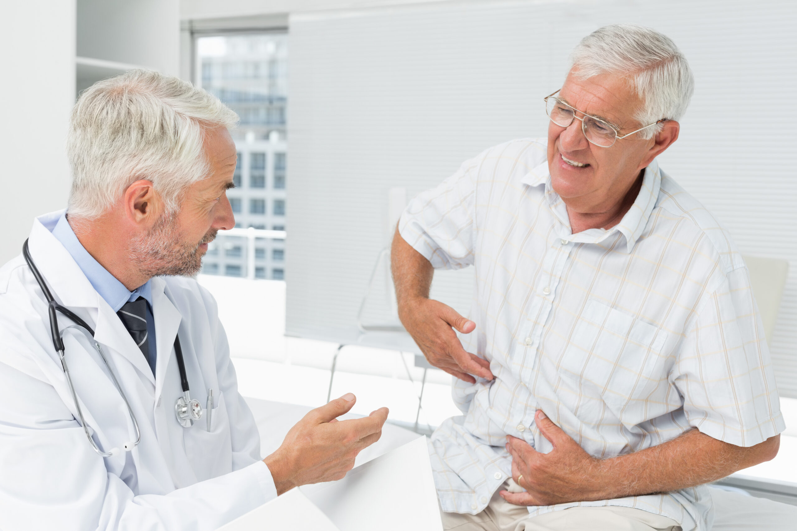 Patient experiencing stomach gas and bloating consulting a gastroenterologist in NYC for SIBO and digestive health treatment